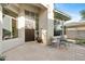 Inviting front patio with flagstone flooring, outdoor seating, and view of desert landscaping at 6426 N 27Th St, Phoenix, AZ 85016