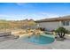 Backyard pool with scenic mountain views, surrounded by desert landscaping and stone patio at 6426 N 27Th St, Phoenix, AZ 85016