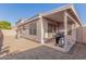 View of home's exterior and backyard featuring a covered patio perfect for outdoor living at 665 E Winchester Way, Chandler, AZ 85286