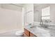 This bathroom features a shower/tub combo and a sink with a granite countertop at 665 E Winchester Way, Chandler, AZ 85286