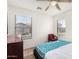 This bedroom features a blue floral mattress, a ceiling fan, and a neutral color palette at 665 E Winchester Way, Chandler, AZ 85286