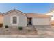 Charming single-story home featuring a well-maintained yard and a spacious two-car garage at 665 E Winchester Way, Chandler, AZ 85286