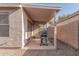 Cozy covered patio with a grill, perfect for outdoor dining and entertaining in a private backyard at 665 E Winchester Way, Chandler, AZ 85286