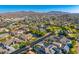 High angle view of a meticulously planned community showcasing various home styles and desert vistas at 6960 E Ivyglen St, Mesa, AZ 85207