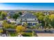 A beautifully landscaped backyard featuring a pool, patio, and manicured greenery at 6960 E Ivyglen St, Mesa, AZ 85207