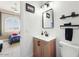 Chic bathroom with sleek fixtures, a modern vanity, and a well-lit mirror, combining style and function at 6960 E Ivyglen St, Mesa, AZ 85207