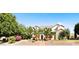 Attractive home exterior featuring mature landscaping, palm trees, and a welcoming front facade at 6960 E Ivyglen St, Mesa, AZ 85207