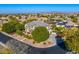 Beautiful view of a suburban property displaying verdant lawns and colorful landscaping at 6960 E Ivyglen St, Mesa, AZ 85207