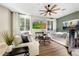 Inviting living room with stylish furniture, large windows, and a calming color palette, perfect for relaxation at 6960 E Ivyglen St, Mesa, AZ 85207