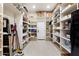 Well-organized walk-in pantry with shelving for ample storage at 6960 E Ivyglen St, Mesa, AZ 85207