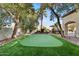 Backyard putting green with manicured landscaping for outdoor recreation at 6960 E Ivyglen St, Mesa, AZ 85207