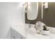 Modern bathroom featuring white quartz counters, custom mirror and stylish decor at 7161 E Rancho Vista Dr # 1011, Scottsdale, AZ 85251