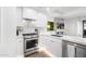 Bright kitchen featuring white cabinets, stainless steel appliances, and elegant countertops for a modern look at 7161 E Rancho Vista Dr # 1011, Scottsdale, AZ 85251