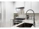 Modern kitchen featuring stainless steel appliances, sleek white cabinetry, and a stylish marble countertop at 7161 E Rancho Vista Dr # 1011, Scottsdale, AZ 85251