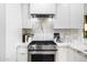 Bright kitchen features white cabinets, stainless steel appliances, and marble countertops and backsplash at 7161 E Rancho Vista Dr # 1011, Scottsdale, AZ 85251