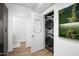 Efficient laundry room with stacked washer/dryer, offering modern convenience and space-saving design at 7161 E Rancho Vista Dr # 1011, Scottsdale, AZ 85251