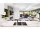 Stylish living area with marble countertops, a fireplace, and a seamless indoor-outdoor flow with a balcony at 7161 E Rancho Vista Dr # 1011, Scottsdale, AZ 85251