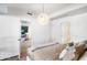 Bright main bedroom with a hanging light fixture, neutral decor, and multiple doorways at 7161 E Rancho Vista Dr # 1011, Scottsdale, AZ 85251
