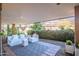 Relaxing covered patio with comfortable seating and lush landscaping at 7161 E Rancho Vista Dr # 1011, Scottsdale, AZ 85251