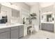 This bathroom features a vanity with dual sinks and a makeup vanity area, with good lighting at 7533 S Woodchute Dr, Gold Canyon, AZ 85118