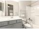 This bathroom features a shower and bathtub combo, a vanity area, and handicap bars at 7533 S Woodchute Dr, Gold Canyon, AZ 85118