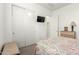 This bedroom features a TV, closet, and a side table, a cozy space at 7533 S Woodchute Dr, Gold Canyon, AZ 85118