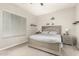 Inviting bedroom featuring a ceiling fan, neutral color palette, and plenty of natural light from the window at 7533 S Woodchute Dr, Gold Canyon, AZ 85118