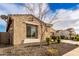 Side exterior shot of a single-story home, showcasing the yard and window at 7533 S Woodchute Dr, Gold Canyon, AZ 85118