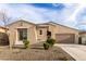 Charming single-story home with desert landscaping and attached two-car garage at 7533 S Woodchute Dr, Gold Canyon, AZ 85118