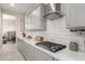 Modern kitchen with stainless steel appliances, gray cabinetry, sleek countertops, and a gas cooktop at 7533 S Woodchute Dr, Gold Canyon, AZ 85118