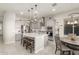 Bright kitchen with stainless steel appliances, gray cabinets, a large center island, and pendant lighting at 7533 S Woodchute Dr, Gold Canyon, AZ 85118
