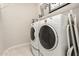 This laundry room has an expansive washer and dryer set and tile flooring at 7533 S Woodchute Dr, Gold Canyon, AZ 85118