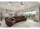 Spacious living room with open floor plan, view of a modern kitchen, and a large sofa at 7533 S Woodchute Dr, Gold Canyon, AZ 85118