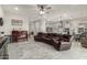 Open concept living room and kitchen, with modern appliances, a piano, and a comfortable sofa at 7533 S Woodchute Dr, Gold Canyon, AZ 85118