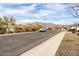 Neighborhood street view with mountain views in the background at 7533 S Woodchute Dr, Gold Canyon, AZ 85118