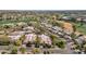 Aerial view of neighborhood with desert landscaping, mature trees, and tile roofs, creating a park-like setting at 7740 E Gainey Ranch Rd # 36, Scottsdale, AZ 85258