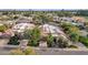 Aerial view of property showcasing lush backyard with private pool, landscaping and golf course views at 7740 E Gainey Ranch Rd # 36, Scottsdale, AZ 85258