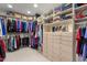 Walk-in closet featuring custom shelving, ample storage and drawers for organization at 7740 E Gainey Ranch Rd # 36, Scottsdale, AZ 85258