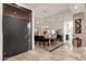 Dining room featuring a mirrored wall, modern lighting, and travertine floors at 7740 E Gainey Ranch Rd # 36, Scottsdale, AZ 85258