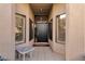 Inviting front entrance with sidelight windows and a sleek black door at 7740 E Gainey Ranch Rd # 36, Scottsdale, AZ 85258
