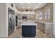 Bright kitchen featuring an island, stainless steel appliances, and custom cabinetry at 7740 E Gainey Ranch Rd # 36, Scottsdale, AZ 85258
