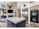 Kitchen with a large center island and stainless steel appliances at 7740 E Gainey Ranch Rd # 36, Scottsdale, AZ 85258
