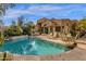 Inviting backyard pool with plenty of lounge seating and lush desert landscaping at 7740 E Gainey Ranch Rd # 36, Scottsdale, AZ 85258