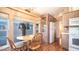 Charming kitchen featuring a breakfast nook, wood-look flooring, and ample natural light at 834 S Beryl Dr, Apache Junction, AZ 85119