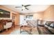 Cozy living area with wood floors, ceiling fan, and comfortable seating at 834 S Beryl Dr, Apache Junction, AZ 85119