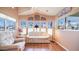 Bright living room with large windows offering a picturesque neighborhood view at 834 S Beryl Dr, Apache Junction, AZ 85119