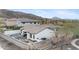 Aerial view of a charming white home featuring a private pool, outdoor seating, and a well-maintained backyard at 9001 S 18Th Way, Phoenix, AZ 85042