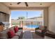 Covered patio seating area with a view of the pool and mountains at 9001 S 18Th Way, Phoenix, AZ 85042