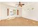 Bright bedroom with natural light streaming in from the multiple windows and neutral carpet at 9001 S 18Th Way, Phoenix, AZ 85042