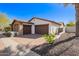 Spacious home featuring a three-car garage and low-maintenance desert landscaping at 9001 S 18Th Way, Phoenix, AZ 85042